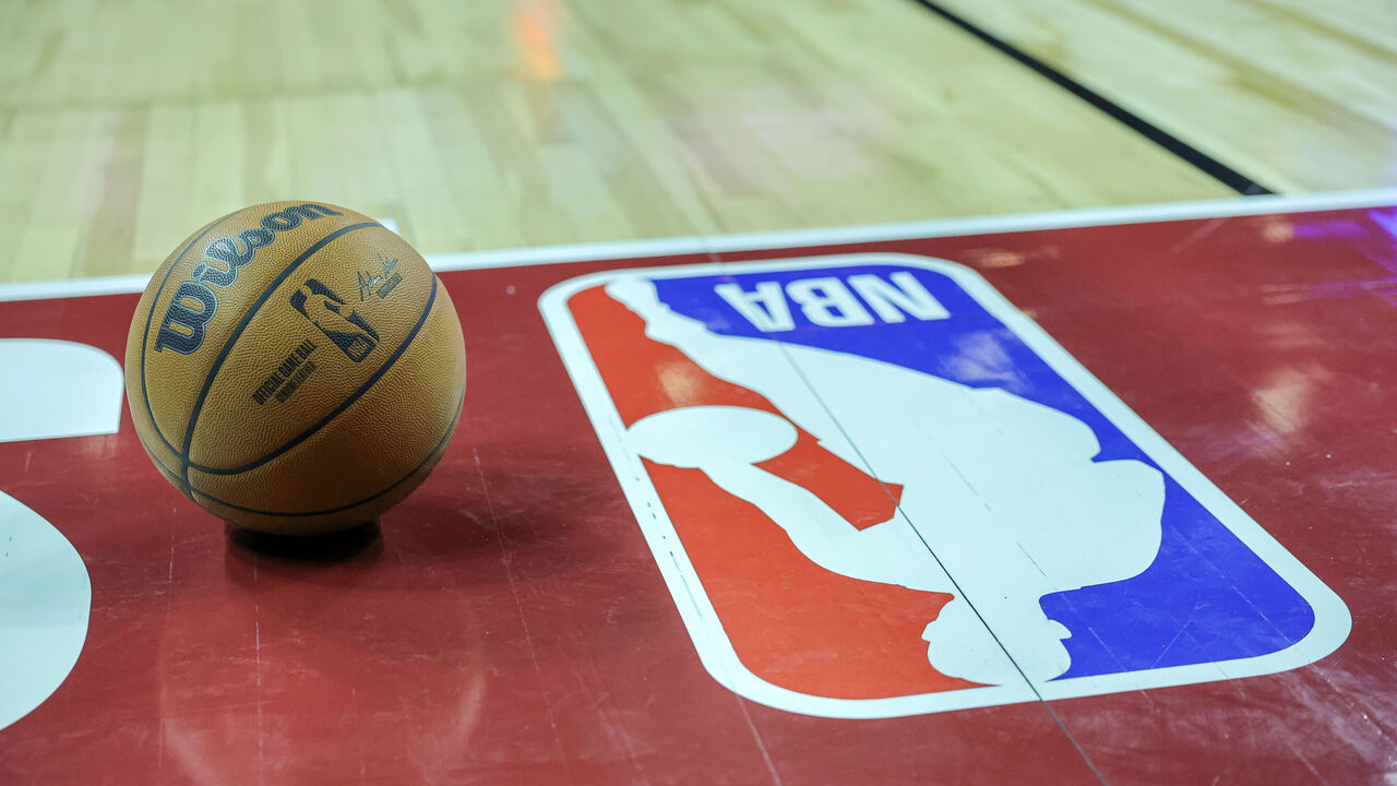 LAS VEGAS, NEVADA - JULY 07: A basketball is placed on the court next to an NBA logo during a break in the first half of a 2023 NBA Summer League game between the Portland Trail Blazers and the Houston Rockets at the Thomas & Mack Center on July 07, 2023 in Las Vegas, Nevada.