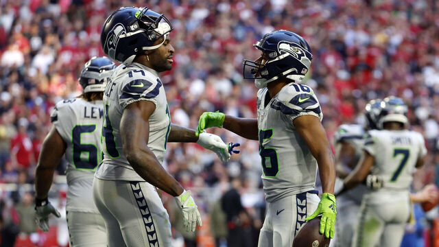 GLENDALE, ARIZONA - NOVEMBER 06: Wide receiver Tyler Lockett #16 reacts with wide receiver DK Metcalf #14 of the Seattle Seahawks after scoring a touchdown during the second half against the Arizona Cardinals at State Farm Stadium on November 06, 2022 in Glendale, Arizona. The Seahawks beat the Cardinals 31-21.