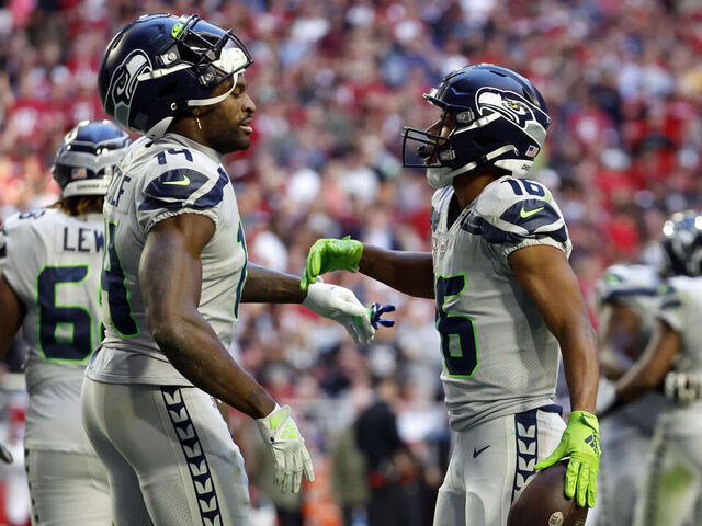 GLENDALE, ARIZONA - NOVEMBER 06: Wide receiver Tyler Lockett #16 reacts with wide receiver DK Metcalf #14 of the Seattle Seahawks after scoring a touchdown during the second half against the Arizona Cardinals at State Farm Stadium on November 06, 2022 in Glendale, Arizona. The Seahawks beat the Cardinals 31-21.