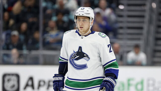 SEATTLE, WASHINGTON - JANUARY 25: Travis Dermott #24 of the Vancouver Canucks skates against the Seattle Kraken during the first period at Climate Pledge Arena on January 25, 2023 in Seattle, Washington.