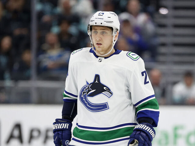 SEATTLE, WASHINGTON - JANUARY 25: Travis Dermott #24 of the Vancouver Canucks skates against the Seattle Kraken during the first period at Climate Pledge Arena on January 25, 2023 in Seattle, Washington.