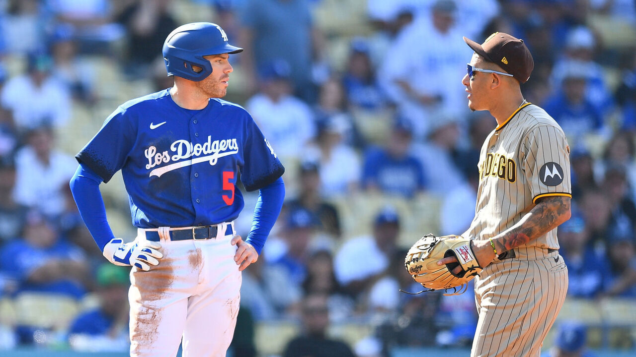 LOS ANGELES, CA - MAY 13: Los Angeles Dodgers first baseman Freddie Freeman (5) talks with San Diego Padres third baseman Manny Machado (13) during the MLB game between the San Diego Padres and the Los Angeles Dodgers on May 13, 2023 at Dodger Stadium in Los Angeles, CA.
