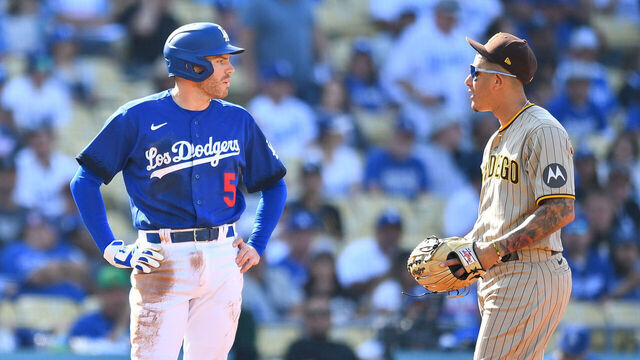 LOS ANGELES, CA - MAY 13: Los Angeles Dodgers first baseman Freddie Freeman (5) talks with San Diego Padres third baseman Manny Machado (13) during the MLB game between the San Diego Padres and the Los Angeles Dodgers on May 13, 2023 at Dodger Stadium in Los Angeles, CA.
