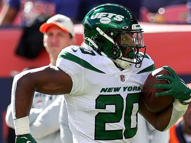 DENVER, CO - OCTOBER 23: New York Jets running back Breece Hall goes 62 yards for a touchdown during a NFL game between the New York Jets and the Denver Broncos on October 23, 2022 at Empower Field at Mile High in Denver, CO.