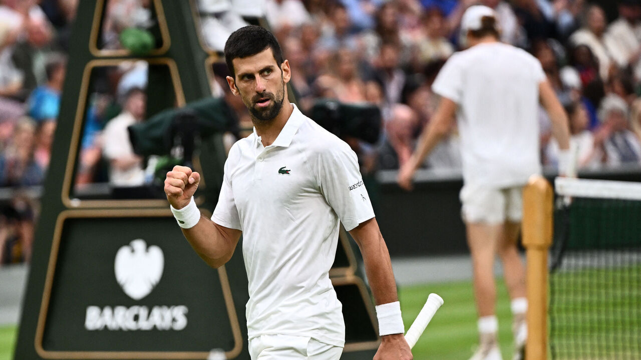 Serbia's Novak Djokovic celebrates winning a point against Italy's Jannik Sinner during their men's singles semi-finals tennis match on the twelfth day of the 2023 Wimbledon Championships at The All England Lawn Tennis Club in Wimbledon, southwest London, on July 14, 2023.