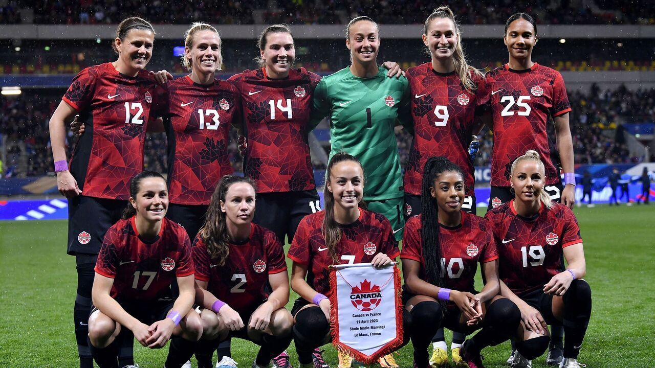 Canada's players pose ahead of the women's international friendly football match between France and Canada at the Marie Marvingt Stadium, in Le Mans, northwestern France, on April 11, 2023.