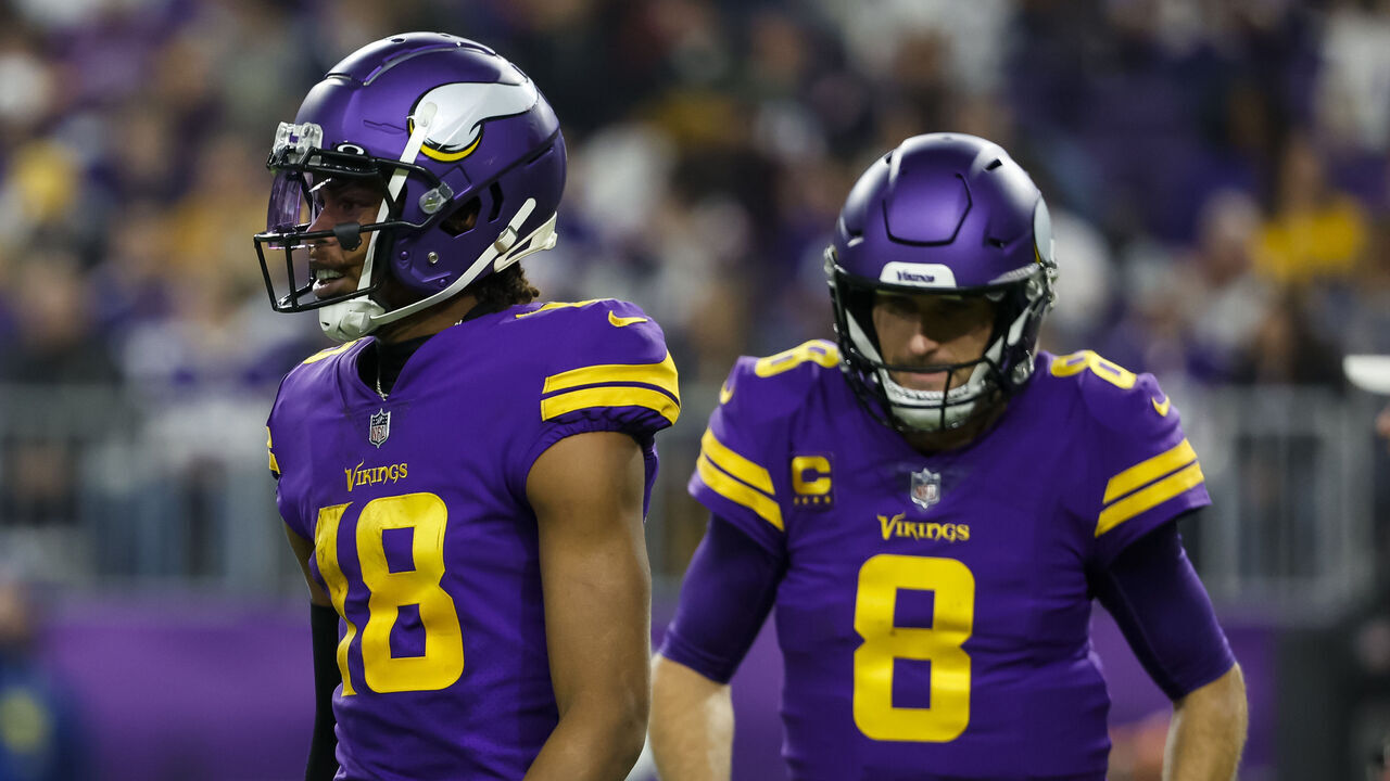 MINNEAPOLIS, MN - NOVEMBER 24: Justin Jefferson #18 and Kirk Cousins #8 of the Minnesota Vikings look on against the New England Patriots in the second quarter of the game at U.S. Bank Stadium in Minneapolis, Minnesota. The Vikings defeated the Patriots 33-26.