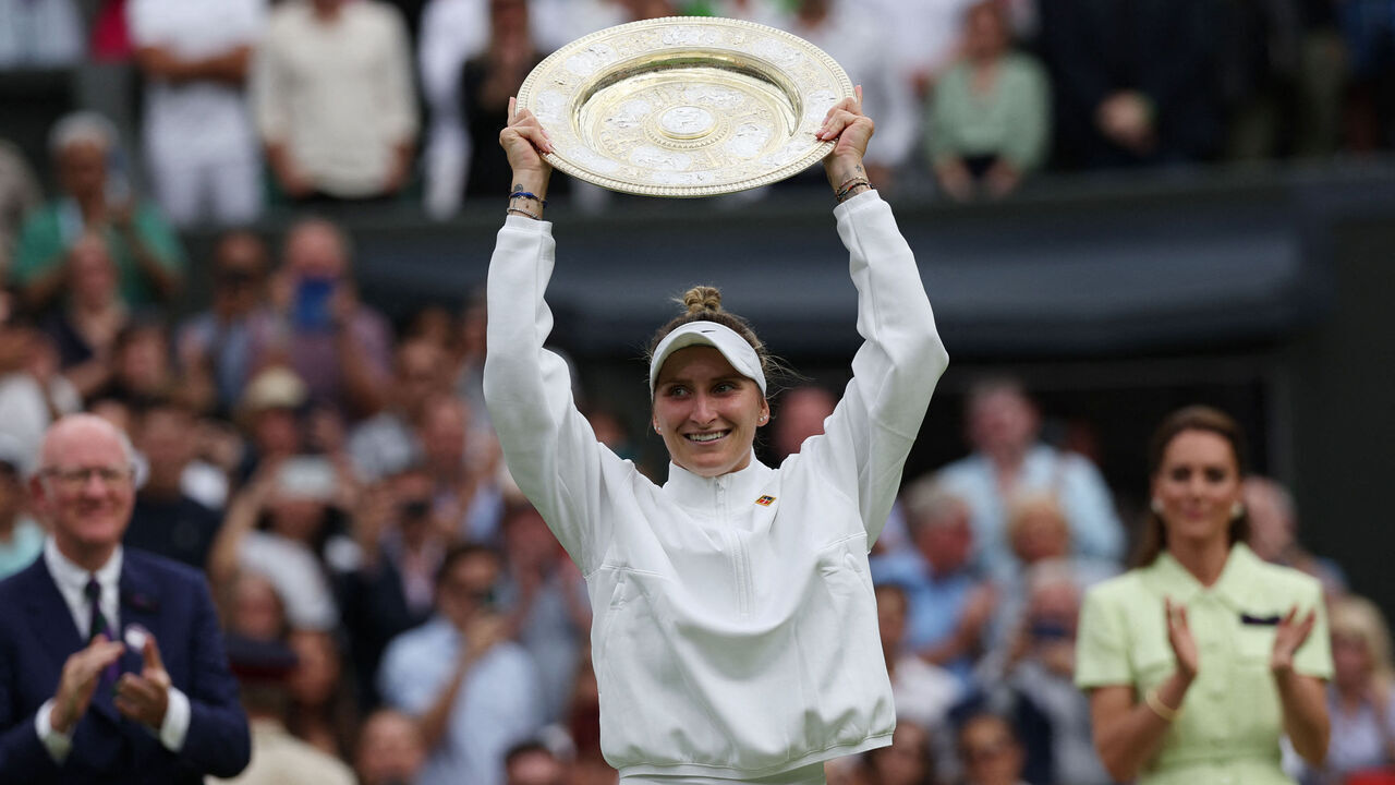 Czech Republic's Marketa Vondrousova celebrates with the Venus Rosewater Dish trophy during the prize ceremony after winning the women's singles final tennis match against Tunisia's Ons Jabeur on the thirteenth day of the 2023 Wimbledon Championships at The All England Lawn Tennis Club in Wimbledon, southwest London, on July 15, 2023.