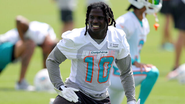 MIAMI GARDENS, FLORIDA - JUNE 08: Tyreek Hill #10 of the Miami Dolphins stretches prior to practice at Baptist Health Training Complex on June 08, 2023 in Miami Gardens, Florida.