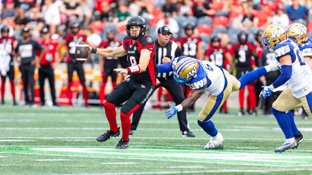 OTTAWA, ON - JULY 15: Ottawa Redblacks quarterback Dustin Crum (18) scrambles during Canadian Football League action between the Winnipeg Blue Bombers and Ottawa Redblacks on July 15, 2023, at TD Place at Lansdowne Park in Ottawa, ON, Canada.