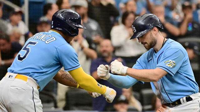 ST PETERSBURG, FLORIDA - APRIL 13: Brandon Lowe #8 celebrates with Wander Franco #5 of the Tampa Bay Rays after hitting a home run in the seventh inning against the Boston Red Sox at Tropicana Field on April 13, 2023 in St Petersburg, Florida.