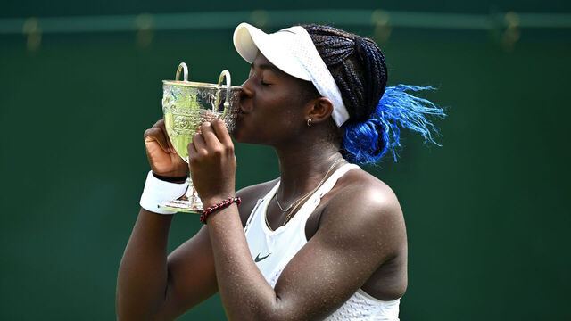 LONDON, ENGLAND - JULY 16: Clervie Ngounoue of United States kisses the Girl's Singles Trophy following victory in the Girl's Singles Final against Nikola Bartunkova of Czech Republic on day fourteen of The Championships Wimbledon 2023 at All England Lawn Tennis and Croquet Club on July 16, 2023 in London, England.