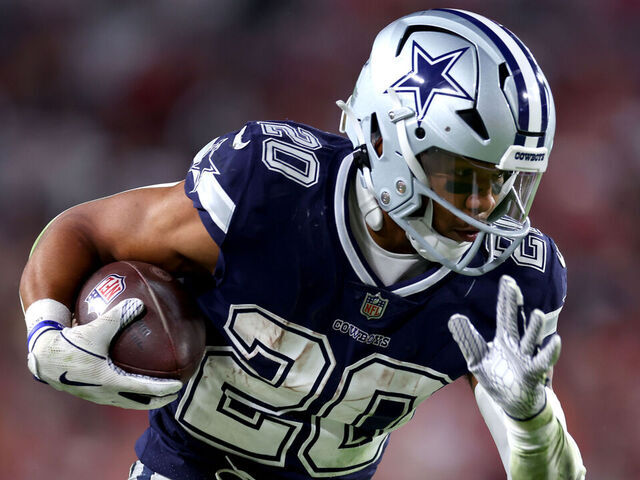 TAMPA, FLORIDA - JANUARY 16: Tony Pollard #20 of the Dallas Cowboys carries the ball against the Tampa Bay Buccaneers during the third quarter in the NFC Wild Card playoff game at Raymond James Stadium on January 16, 2023 in Tampa, Florida.