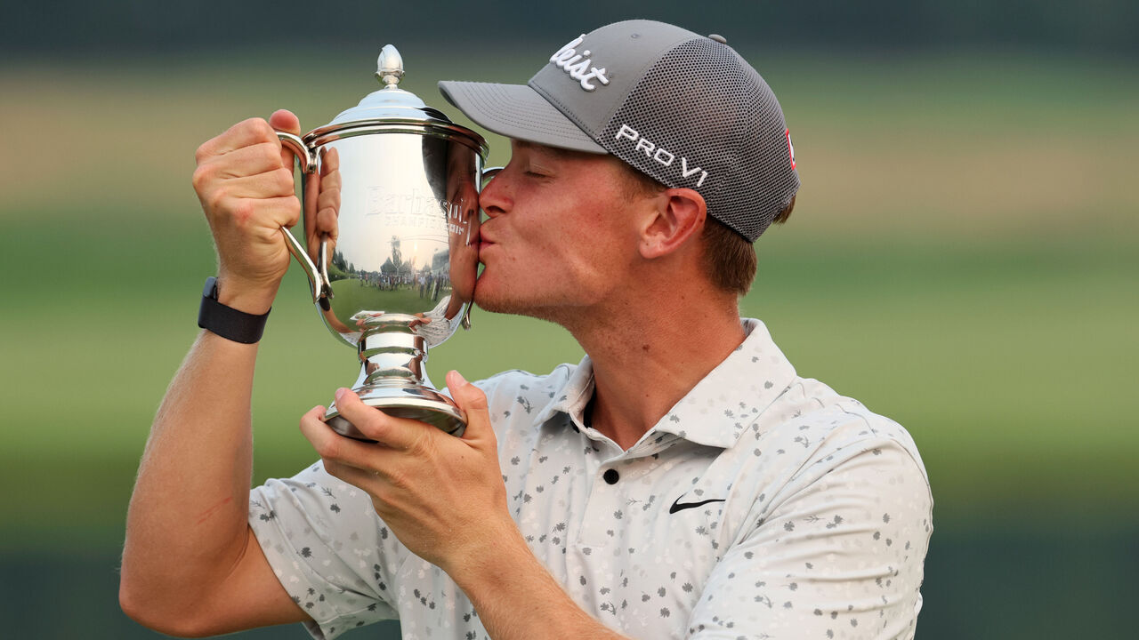 NICHOLASVILLE, KENTUCKY - JULY 16: Vincent Norrman of Sweden celebrates with the trophy after putting in to win on the 18th hole during the sudden death playoff against Nathan Kimsey of England during the final round of the Barbasol Championship at Keene Trace Golf Club on July 16, 2023 in United States.