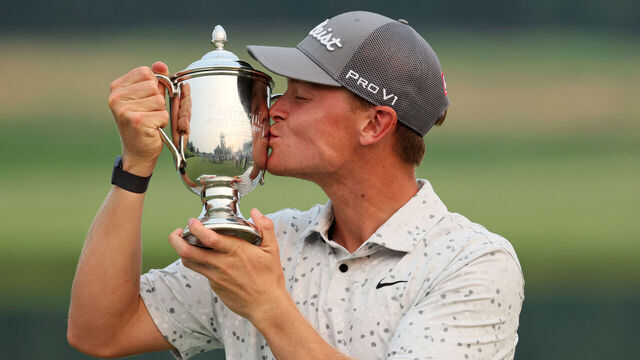NICHOLASVILLE, KENTUCKY - JULY 16: Vincent Norrman of Sweden celebrates with the trophy after putting in to win on the 18th hole during the sudden death playoff against Nathan Kimsey of England during the final round of the Barbasol Championship at Keene Trace Golf Club on July 16, 2023 in United States.