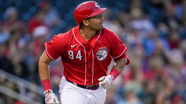 GOODYEAR, ARIZONA - MARCH 10: Christian Encarnacion-Strand #94 of the Cincinnati Reds hits a home run in the first inning against the Arizona Diamondbacks during a spring training game at Goodyear Ballpark on March 10, 2023 in Goodyear, Arizona.