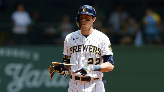 MILWAUKEE, WISCONSIN - JULY 09: Christian Yelich #22 of the Milwaukee Brewers stands at second base after hitting a double against the Cincinnati Reds at American Family Field on July 09, 2023 in Milwaukee, Wisconsin.