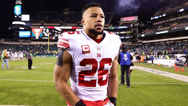 PHILADELPHIA, PENNSYLVANIA - JANUARY 21: Saquon Barkley #26 of the New York Giants walks off the field after losing to the Philadelphia Eagles 38-7 in the NFC Divisional Playoff game at Lincoln Financial Field on January 21, 2023 in Philadelphia, Pennsylvania.