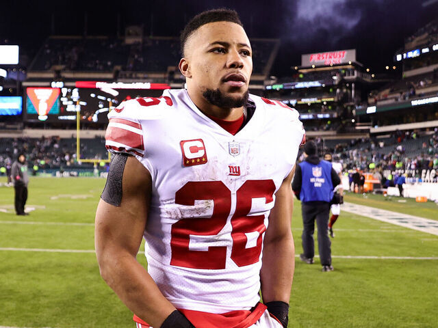 PHILADELPHIA, PENNSYLVANIA - JANUARY 21: Saquon Barkley #26 of the New York Giants walks off the field after losing to the Philadelphia Eagles 38-7 in the NFC Divisional Playoff game at Lincoln Financial Field on January 21, 2023 in Philadelphia, Pennsylvania.