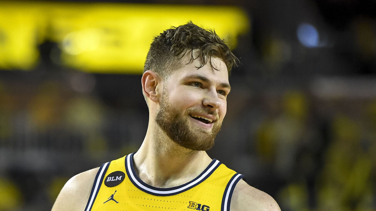 ANN ARBOR, MICHIGAN - MARCH 01: Hunter Dickinson #1 of the Michigan Wolverines looks on and smiles against the Michigan State Spartans during the second half at Crisler Arena on March 01, 2022 in Ann Arbor, Michigan.