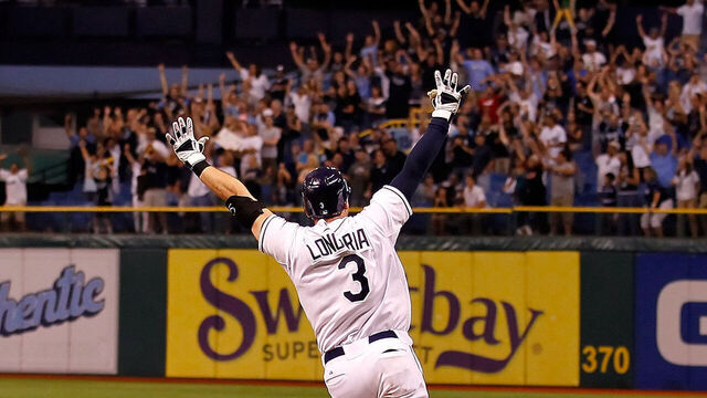 ST. PETERSBURG, FL - SEPTEMBER 28: Evan Longoria #3 of the Tampa Bay Rays rounds the bases after his game-winning walk off home run in the twelfth inning against the New York Yankees during the game at Tropicana Field on September 28, 2011 in St. Petersburg, Florida.