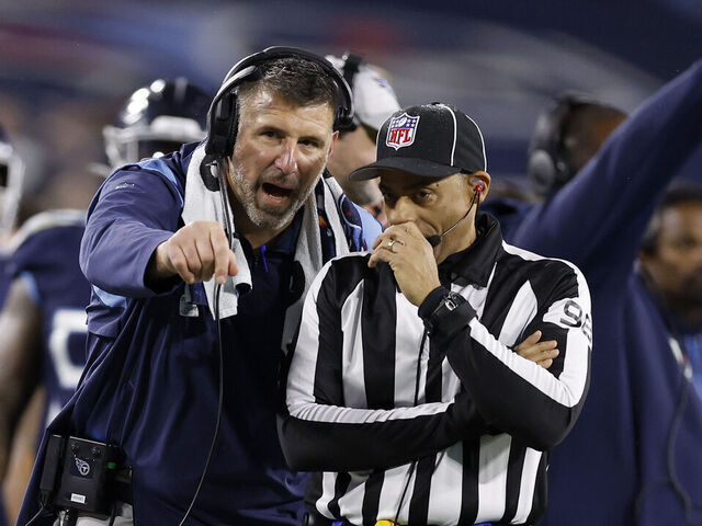 NASHVILLE, TENNESSEE - DECEMBER 29: Head coach Mike Vrabel of the Tennessee Titans argues with line judge Greg Bradley #98 against the Dallas Cowboys during the first quarter of the game at Nissan Stadium on December 29, 2022 in Nashville, Tennessee.