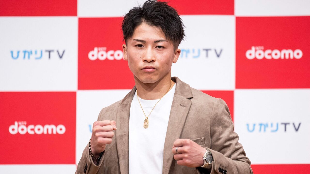 Boxer Naoya Inoue poses for photographs during a press conference in Yokohama on January 13, 2023.