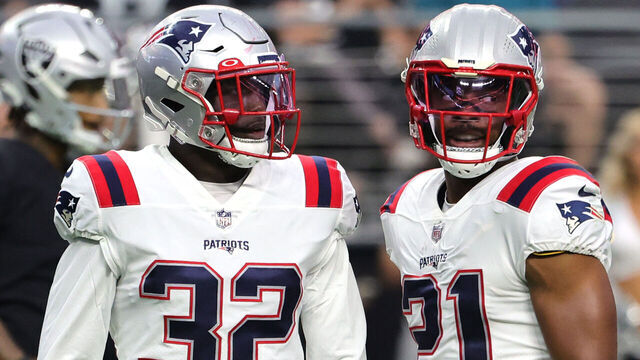LAS VEGAS, NEVADA - AUGUST 26: Safeties Devin McCourty #32 and Adrian Phillips #21 of the New England Patriots stand on the field between plays against the Las Vegas Raiders during their preseason game at Allegiant Stadium on August 26, 2022 in Las Vegas, Nevada. The Raiders defeated the Patriots 23-6.