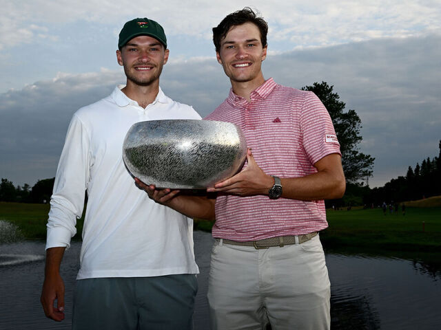 AALBORG, DENMARK - JULY 09: Rasmus Hojgaard of Denmark poises with his brother Nicolai Hojgaard of Denmark after winning on the sixth play off hole after the final of the Made in HimmerLand at Himmerland Golf & Spa Resort on July 09, 2023 in Denmark.