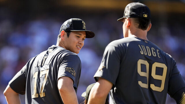 Los Angeles, CA - July 19: American League All-Star outfielders Aaron Judge, right, along with American League All-Star Shohei Ohtani of the Los Angeles Angels line up before an MLB All-Star baseball game against the National League All-Stars at Dodger Stadium in Los Angeles on Tuesday, July 19, 2022.