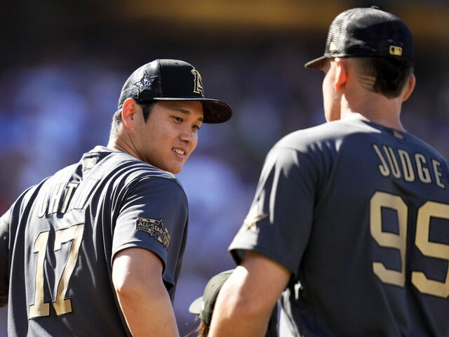 Los Angeles, CA - July 19: American League All-Star outfielders Aaron Judge, right, along with American League All-Star Shohei Ohtani of the Los Angeles Angels line up before an MLB All-Star baseball game against the National League All-Stars at Dodger Stadium in Los Angeles on Tuesday, July 19, 2022.