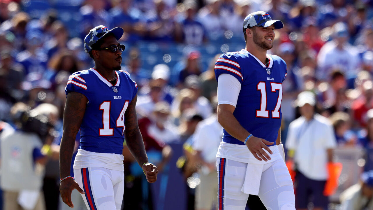 ORCHARD PARK, NEW YORK - AUGUST 13: Stefon Diggs #14 and Josh Allen #17 of the Buffalo Bills walk on the field prior to a preseason game against the Indianapolis Colts at Highmark Stadium on August 13, 2022 in Orchard Park, New York.