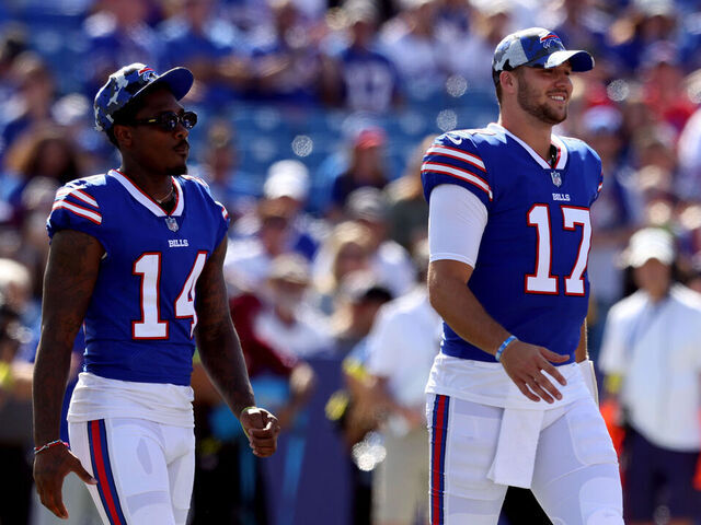 ORCHARD PARK, NEW YORK - AUGUST 13: Stefon Diggs #14 and Josh Allen #17 of the Buffalo Bills walk on the field prior to a preseason game against the Indianapolis Colts at Highmark Stadium on August 13, 2022 in Orchard Park, New York.