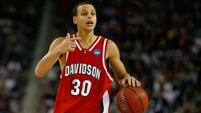 DETROIT - MARCH 30: Stephen Curry #30 of the Davidson Wildcats directs the offense against the Kansas Jayhawks during the Midwest Regional Final of the 2008 NCAA Division I Men's Basketball Tournament at Ford Field on March 30, 2008 in Detroit, Michigan. Kansas won 59-57.