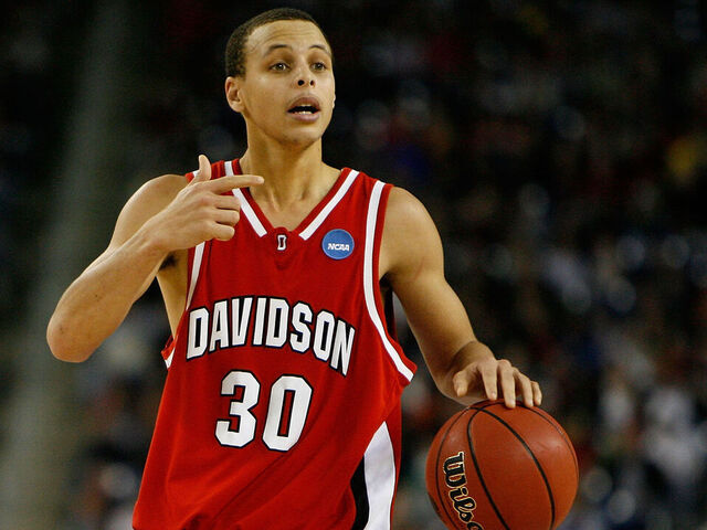DETROIT - MARCH 30: Stephen Curry #30 of the Davidson Wildcats directs the offense against the Kansas Jayhawks during the Midwest Regional Final of the 2008 NCAA Division I Men's Basketball Tournament at Ford Field on March 30, 2008 in Detroit, Michigan. Kansas won 59-57.