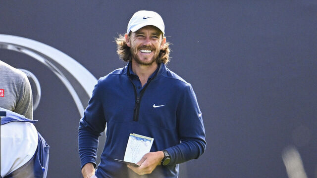 HOYLAKE, ENGLAND - JULY 20: Tommy Fleetwood of England smiles with Adam Scott of Australia on the first tee during the first round of The 151st Open Championship at Royal Liverpool Golf Club on July 20, 2023 in Hoylake, England.