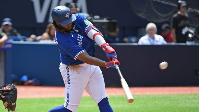 TORONTO, ON - JULY 20: Toronto Blue Jays First base Vladimir Guerrero Jr. (27) hits a home run in the seventh inning during the regular season MLB game between the San Diego Padres and Toronto Blue Jays on July 20, 2023 at Rogers Centre in Toronto, ON.