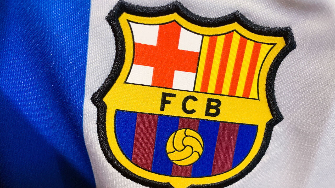 FC Barcelona logo is seen on a football jersey in this illustration photo taken in a store in Krakow, Poland on May 6, 2023.