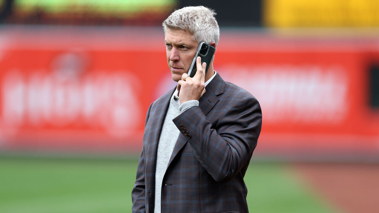 BALTIMORE, MARYLAND - APRIL 08: Baltimore Orioles general manager Mike Elias talks on the phone before the start of the Orioles and New York Yankees game at Oriole Park at Camden Yards on April 08, 2023 in Baltimore, Maryland.