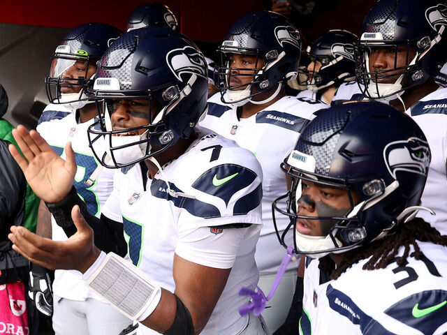 SANTA CLARA, CALIFORNIA - JANUARY 14: Geno Smith #7 of the Seattle Seahawks stands in the tunnel with his teammates prior to the NFC Wild Card playoff game against the San Francisco 49ers at Levi's Stadium on January 14, 2023 in Santa Clara, California.