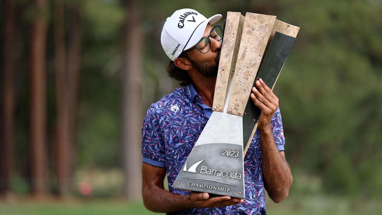 TRUCKEE, CALIFORNIA - JULY 23: Akshay Bhatia of the United States poses with the trophy after putting in to win on the 18th green during a playoff against Patrick Rodgers of the United States during the final round of the Barracuda Championship at Tahoe Mountain Club on July 23, 2023 in United States.