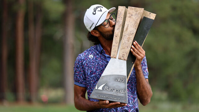TRUCKEE, CALIFORNIA - JULY 23: Akshay Bhatia of the United States poses with the trophy after putting in to win on the 18th green during a playoff against Patrick Rodgers of the United States during the final round of the Barracuda Championship at Tahoe Mountain Club on July 23, 2023 in United States.