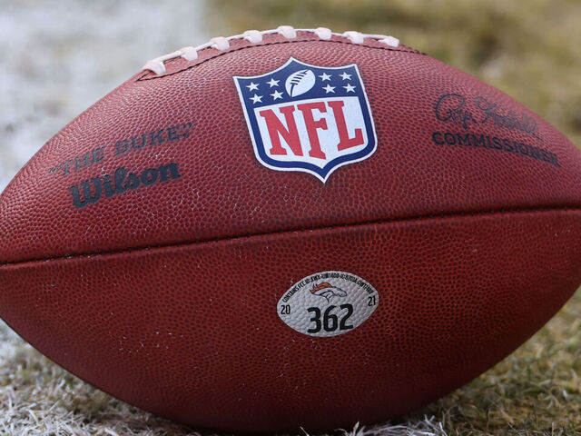 KANSAS CITY, MO - JANUARY 01: A view of the NFL logo on a football before an AFC West game between the Denver Broncos and Kansas City Chiefs on January 1, 2023 at GEHA Field at.Arrowhead Stadium in Kansas City, MO.