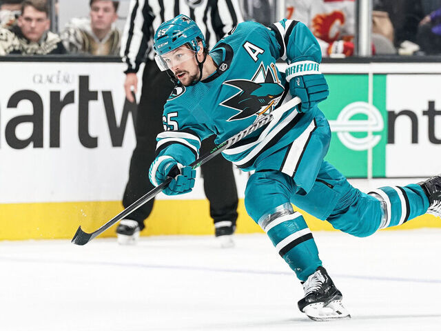 SAN JOSE, CA - DECEMBER 20: Erik Karlsson #65 of the San Jose Sharks takes a shot on goal against the Calgary Flames at SAP Center on December 20, 2022 in San Jose, California.