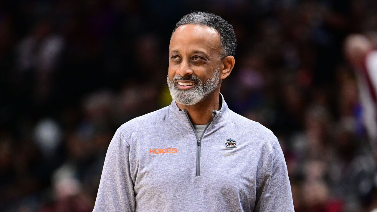 DALLAS, TX - MARCH 31: Kenny Brooks head coach of the Virginia Tech Hokies watches his team against the Louisiana State Tigers during the semifinals of the NCAA Womens Basketball Tournament Final Four at American Airlines Center on March 31, 2023 in Dallas, Texas.