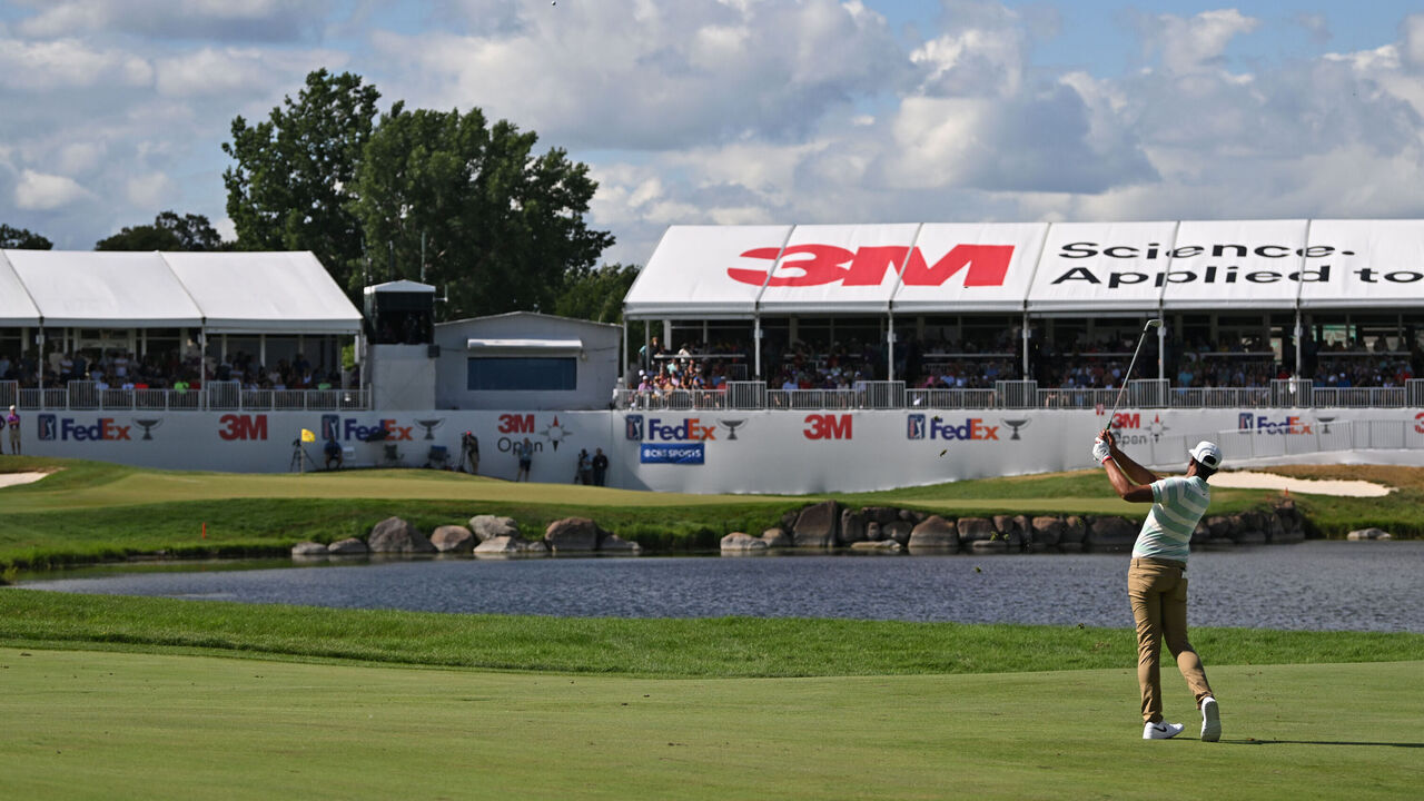 BLAINE, MN - JULY 24: Tony Finau hits the green on this approach shot on the 18th hole during the final round of the 3M Open at TPC Twin Cities on July 24, 2022 in Blaine, Minnesota
