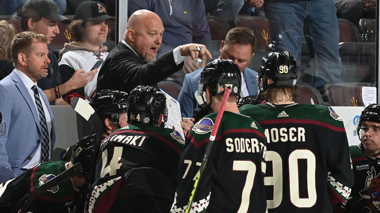 TEMPE, ARIZONA - MARCH 27: Head Coach Andre Tourigny of the Arizona Coyotes discusses with players during a timeout in the third period against the Edmonton Oilers at Mullett Arena on March 27, 2023 in Tempe, Arizona. The Oilers defeated the Coyotes 5-4.