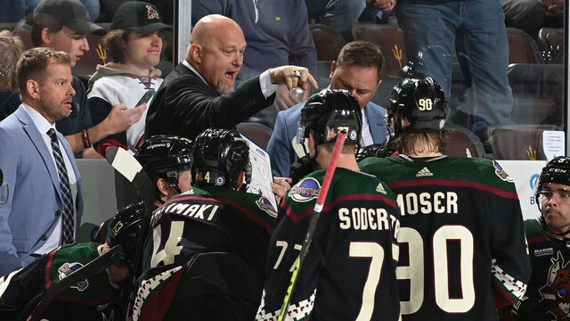 TEMPE, ARIZONA - MARCH 27: Head Coach Andre Tourigny of the Arizona Coyotes discusses with players during a timeout in the third period against the Edmonton Oilers at Mullett Arena on March 27, 2023 in Tempe, Arizona. The Oilers defeated the Coyotes 5-4.
