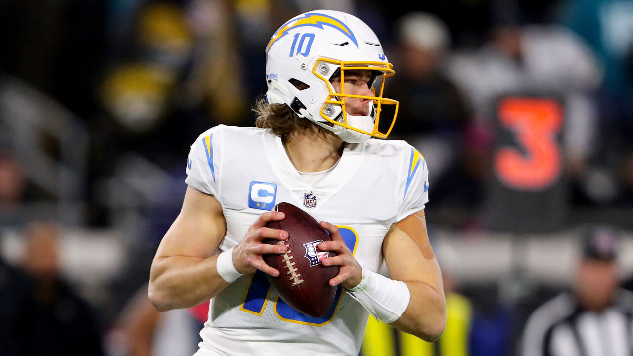 JACKSONVILLE, FLORIDA - JANUARY 14: Justin Herbert #10 of the Los Angeles Chargers looks to pass against the Jacksonville Jaguars during the first half of the game in the AFC Wild Card playoff game at TIAA Bank Field on January 14, 2023 in Jacksonville, Florida.