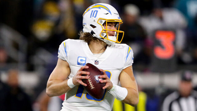 JACKSONVILLE, FLORIDA - JANUARY 14: Justin Herbert #10 of the Los Angeles Chargers looks to pass against the Jacksonville Jaguars during the first half of the game in the AFC Wild Card playoff game at TIAA Bank Field on January 14, 2023 in Jacksonville, Florida.